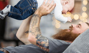 bearded-dad-holding-baby
