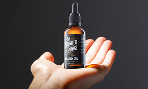 man-showing-how-to-apply-beard-oil