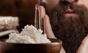 man-using-shea-butter-on-beard
