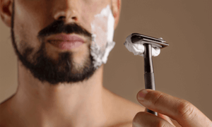 man-shaving-his-beard-off