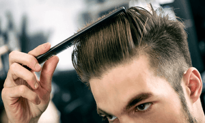 man-styling-his-hair-with-pomade