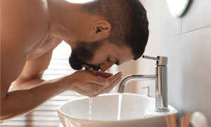 man-washing-his-beard