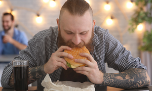 bearded-man-eating-hamburger